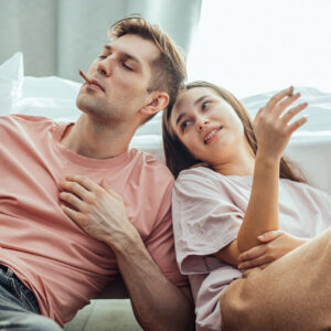 Young couple smoking a marijuana joint | For a blog on how to increase fertility with lifestyle choices | Conceive NJ | Wall Township, NJ